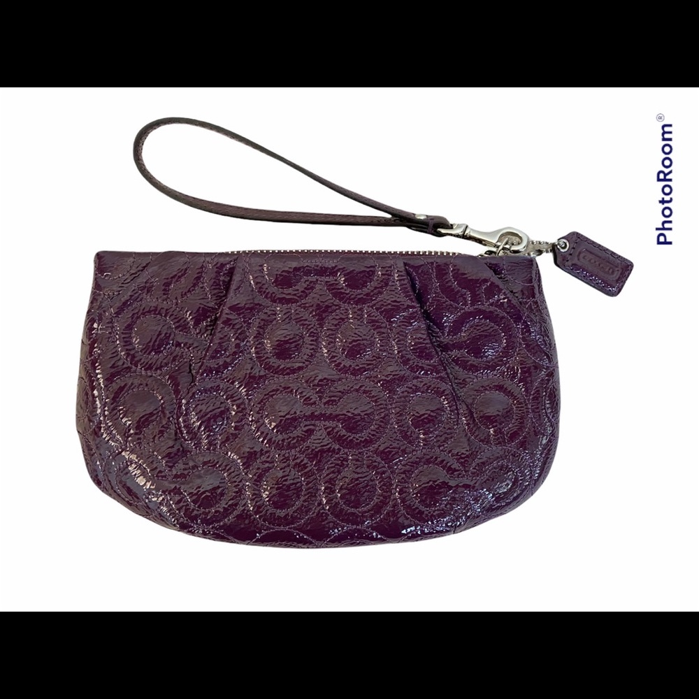 Coach wristlet  plum color